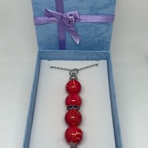 Exquisite Red Swirl Necklace
Expertly Handcrafted, Exclusively Yours